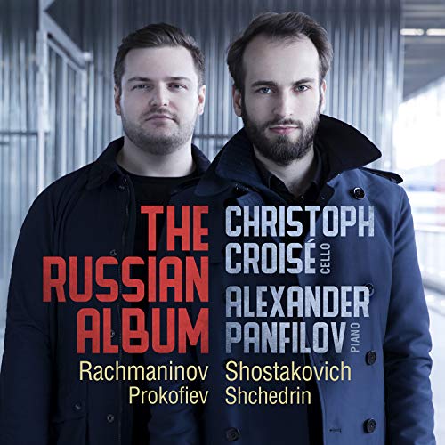 "Album cover featuring two men, with text overlay listing artists and composers."