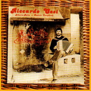 CD cover: man with accordion, rustic doorway, woven border.