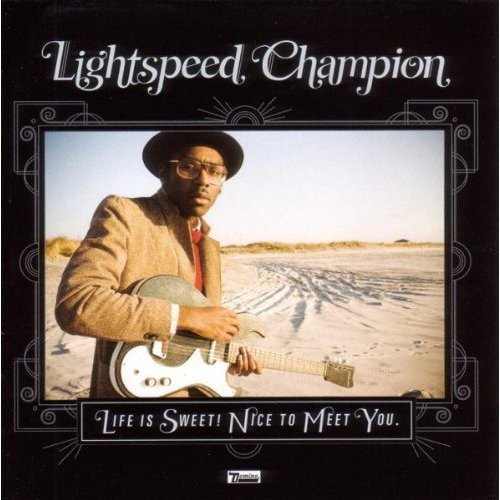 Album cover for Lightspeed Champion, featuring a man with a guitar.