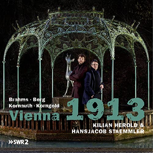 CD cover: musicians standing near a gazebo and deer statue.