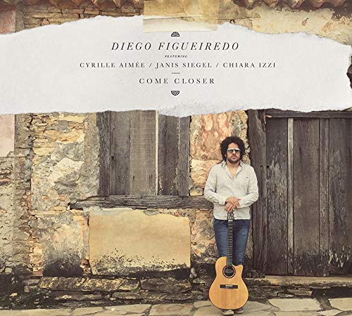 CD cover: Diego Figueiredo with guitar, stone wall background.