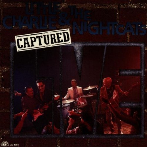 "CD cover with band members behind bars, 'Captured Live' album title."