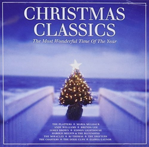 "CD cover with a lit Christmas tree on a snowy pathway, blue background."