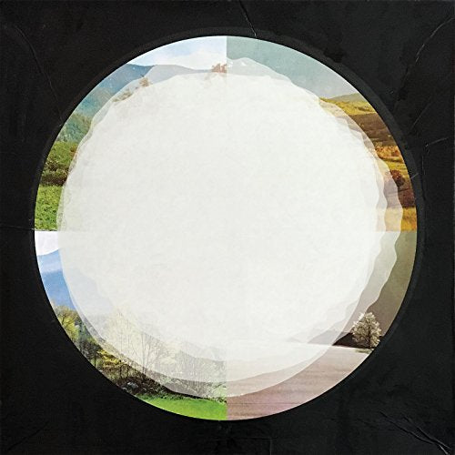 A vinyl record with a landscape image on its label, set against a black background.