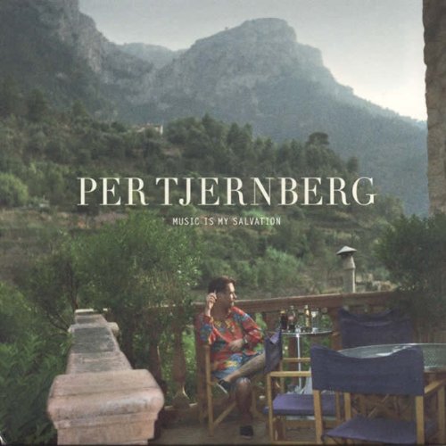 CD cover: man with headphones seated outdoors, mountains in background.