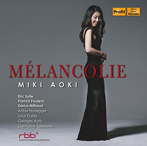 Woman in black dress on album cover with red and white text.