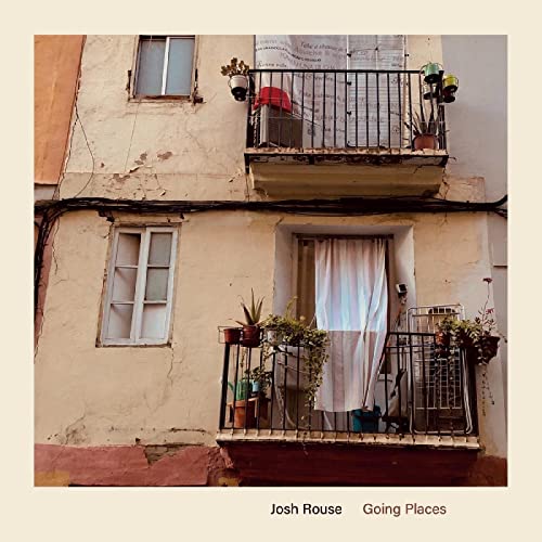 CD cover: weathered building facade with balconies and plants.