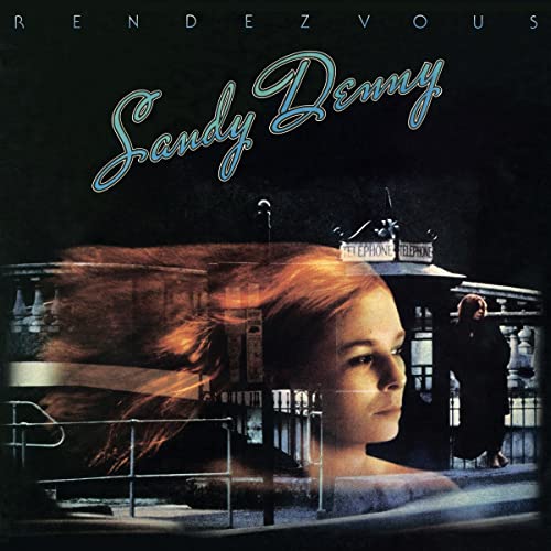 Sandy Denny album cover: woman’s face with blurred figures and a phone booth.