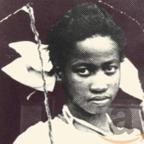 Black and white portrait of a woman with a white flower.