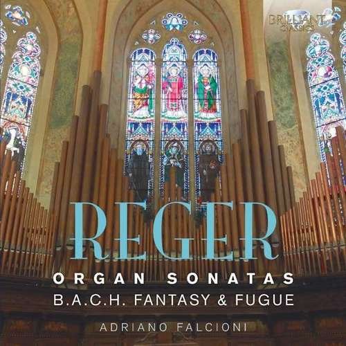 "CD cover featuring a church organ and stained glass window."