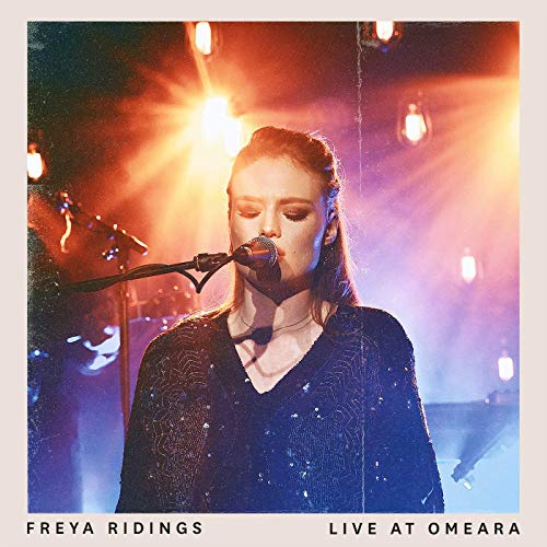 Vinyl album cover featuring Freya Ridings singing into a microphone on stage.