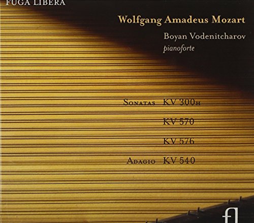 A CD cover featuring piano keys and Mozart's sonatas listing.