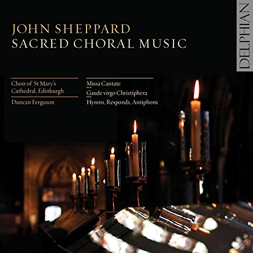 "CD cover with lit candles on an altar, surrounded by darkness."