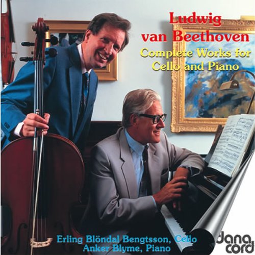"CD cover featuring a cellist and pianist in formal attire, smiling together."