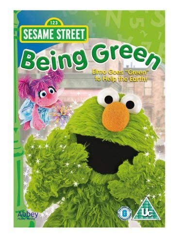 "Sesame Street Being Green DVD cover featuring Oscar the Grouch and a pink Muppet."