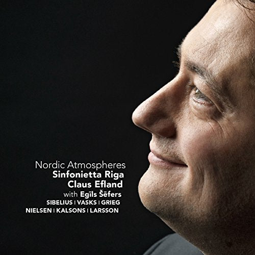 "CD cover with a man's profile and white text on a black background."