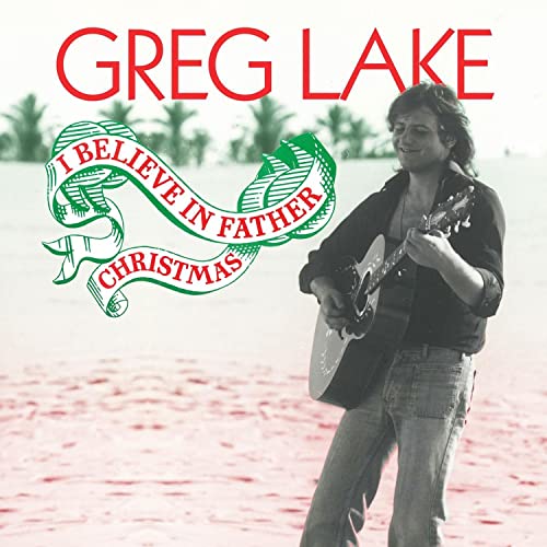 Greg Lake with acoustic guitar, festive banner, beach background.