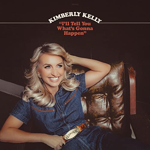 CD cover featuring blonde woman in denim jumpsuit, leaning on a leather chair.