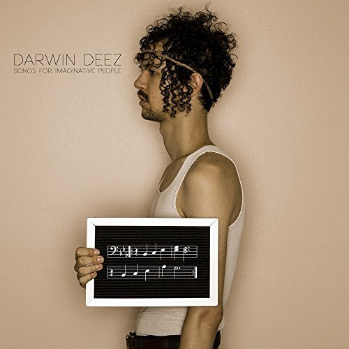 CD cover featuring a man in profile holding sheet music.