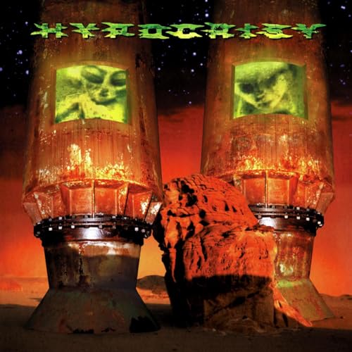 Hypocrisy album cover: two towers with glowing faces in a desert landscape.