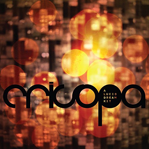 "Album cover with 'Crisopa - A Lucid Dream Kit' text over blurred orange lights."