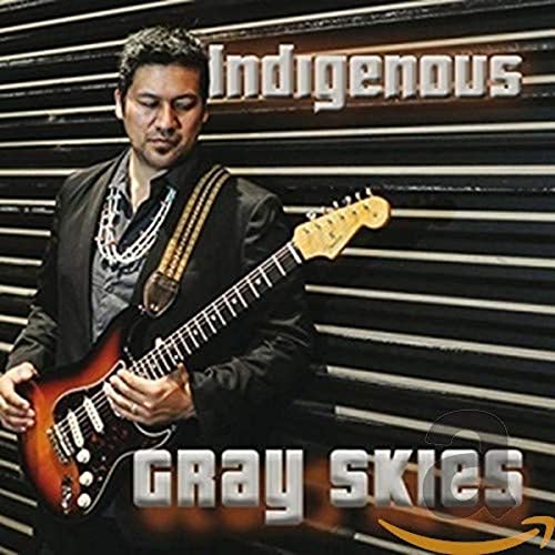 Man with guitar, album cover for Indigenous’s “Gray Skies” CD.