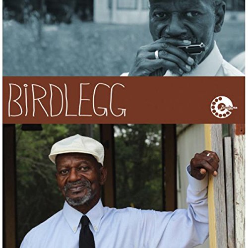 "Album cover featuring a man in two different poses, playing harmonica and leaning on a door."