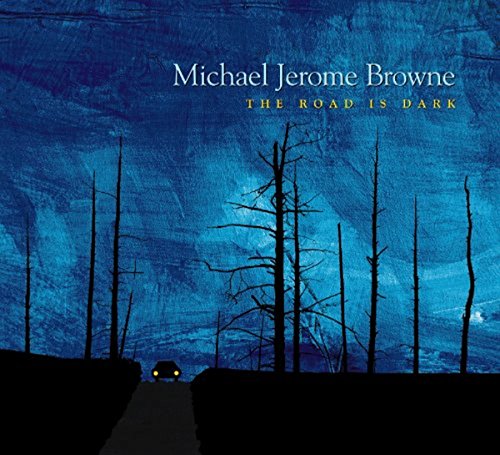 "Album cover with a car on a dark road, bare trees, and blue sky."