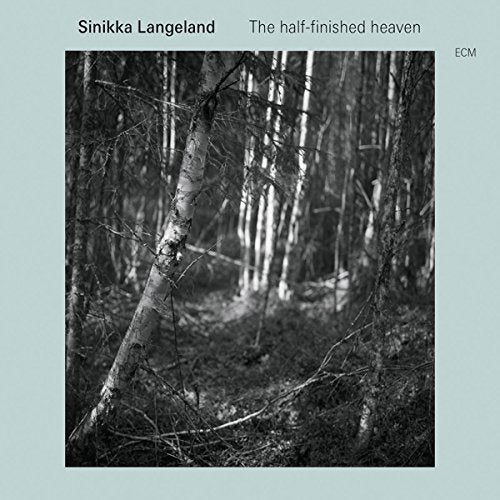 "Music album cover featuring a black-and-white forest image on a light green background."