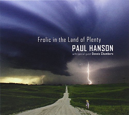 "Album cover with a person on a dirt road during a thunderstorm."