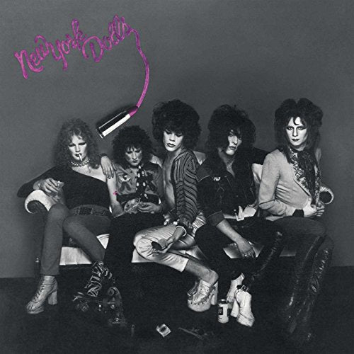 Black and white photo of the New York Dolls band posing together.