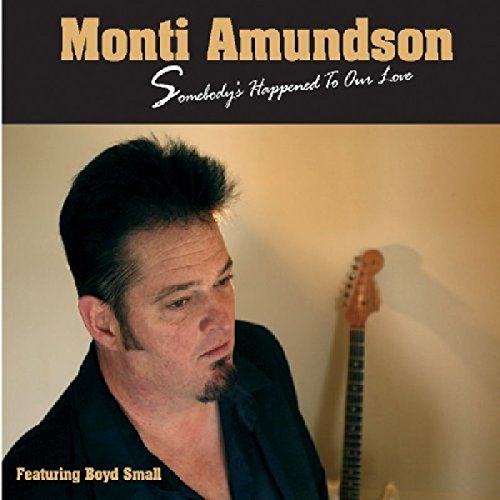 "CD cover featuring a man with a guitar, titled 'Monti Amundson'."