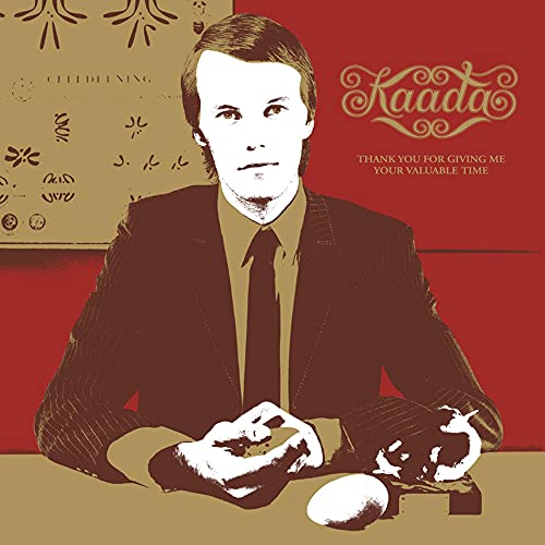 CD cover: portrait of a man with hands and objects on a table.