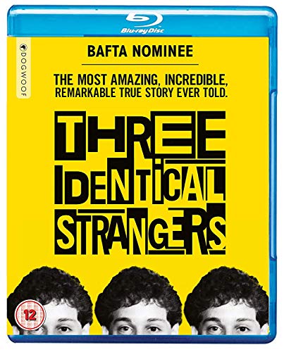"Blu-ray case with yellow cover featuring three identical men's faces and title 'Three Identical Strangers'."