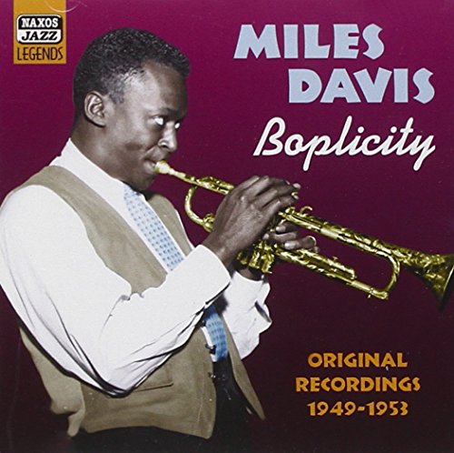CD cover featuring Miles Davis playing trumpet, with burgundy background and text overlay.