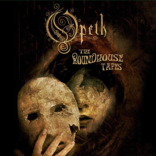 "Album cover art featuring a person holding a broken mask, with dark background."