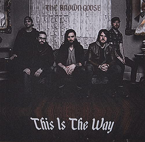 "Album cover with five men sitting and standing in a dimly lit room."