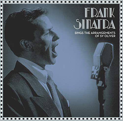 Frank Sinatra singing into a vintage microphone on a blue-toned album cover.