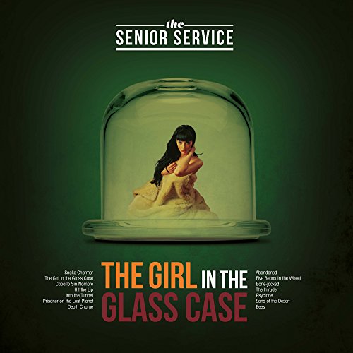 Vinyl album cover: woman in a glass dome, green background.