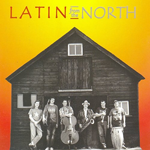 "Album cover with five men standing in front of a barn, holding various instruments."