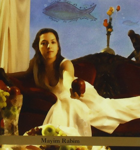 Woman in white dress sitting on couch, holding an apple, surrounded by flowers.