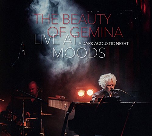 CD cover: musicians performing on a dimly lit stage with smoke.