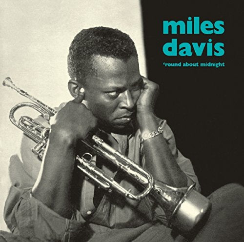 Miles Davis album cover, black and white portrait with trumpet.