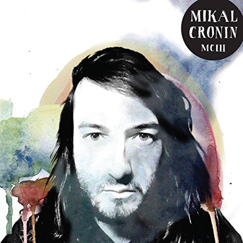 Black and white portrait of Mikal Cronin with watercolor paint splashes.
