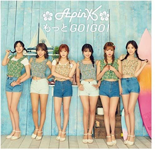 Six women in summer clothes stand together against a blue backdrop.