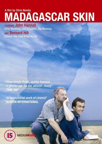 DVD cover for Madagascar Skin featuring two men sitting on a sandy beach.