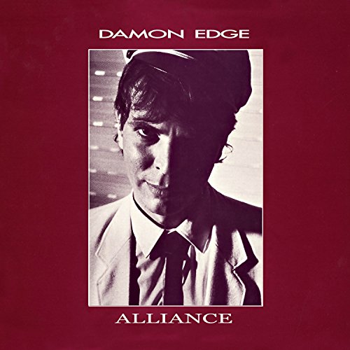 Red album cover with a black and white photo of a man.