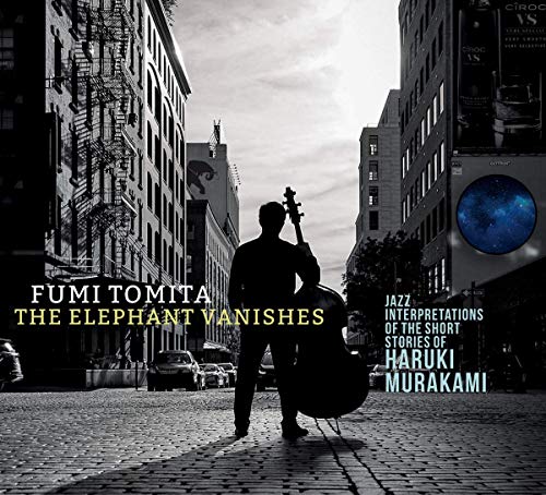 A jazz CD cover featuring a man with a double bass on a city street.