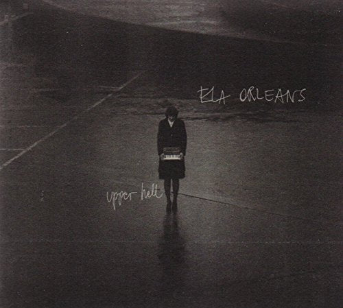 CD cover: lone figure with accordion on a wet, dark surface.