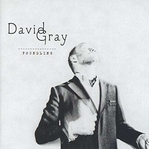 Black and white album cover featuring a man in a suit, head tilted back.